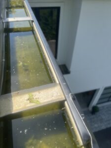 a clogged gutter from above