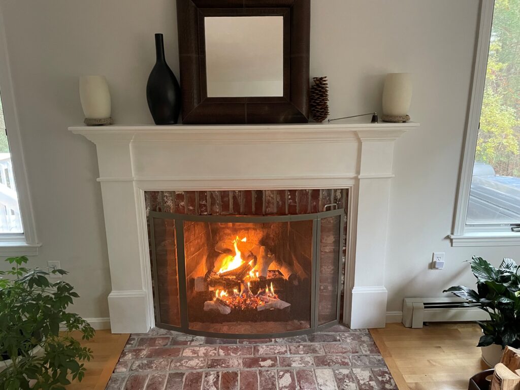 vented log fireplace in a white mantle